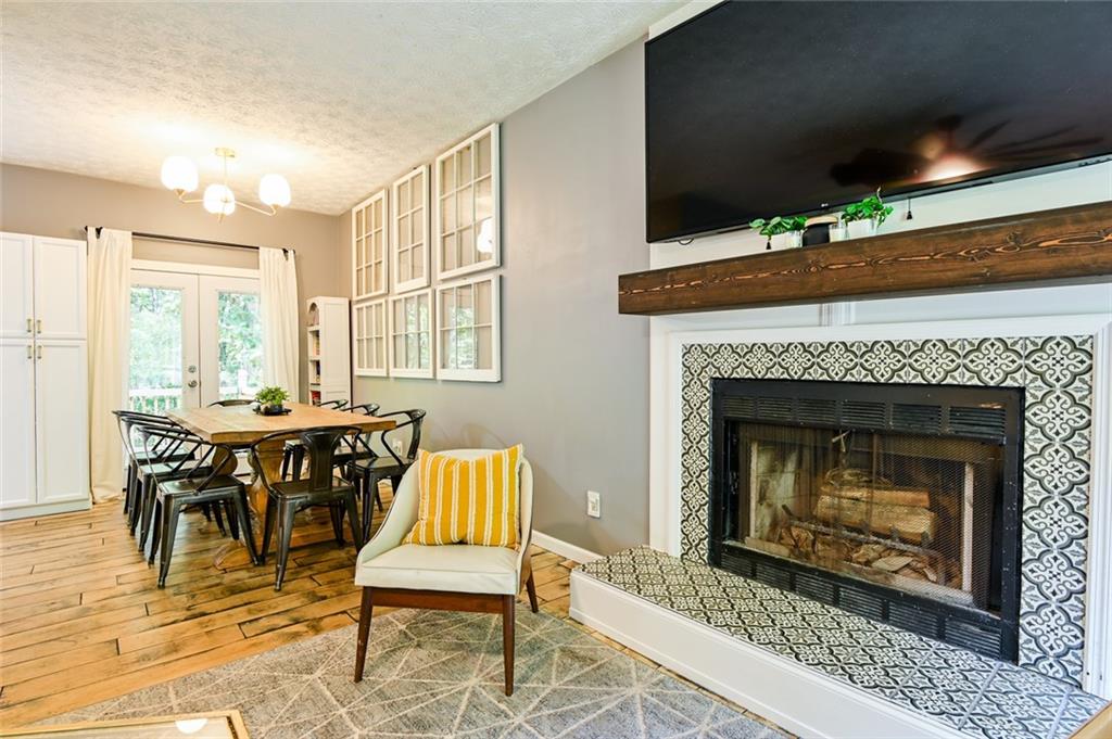 40 Mildred Lane Covington, GA 30016 - Photo 13 of 56 a living room with furniture a fireplace and a table