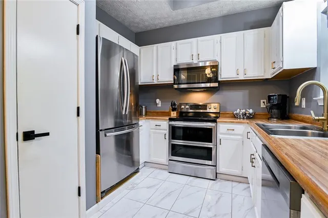a kitchen with a sink and a window