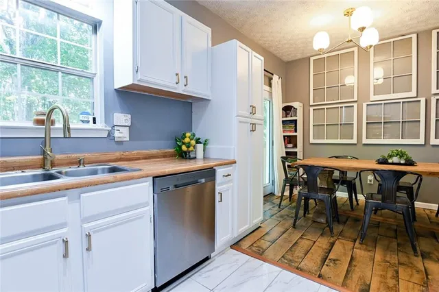 a kitchen with a sink and a window