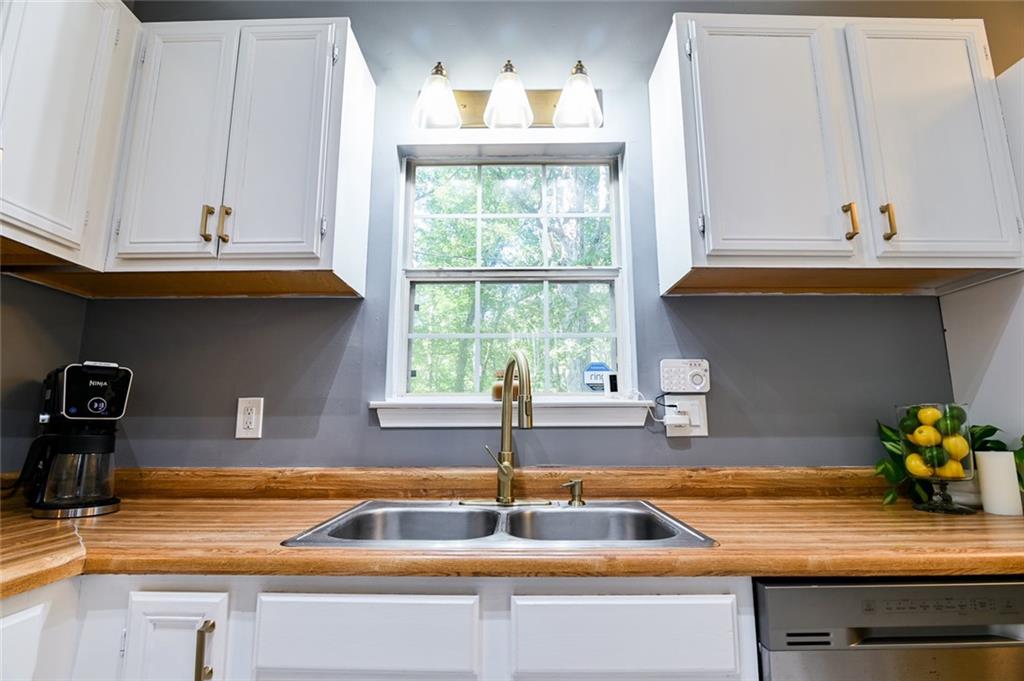40 Mildred Lane Covington, GA 30016 - Photo 21 of 56 a kitchen with a sink and a window