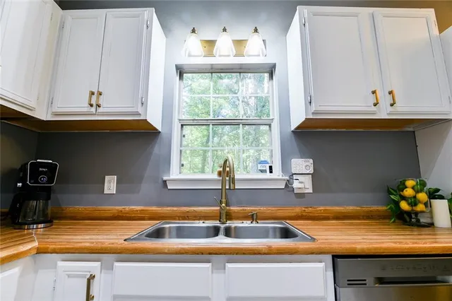 a view of balcony with wooden floor and fence