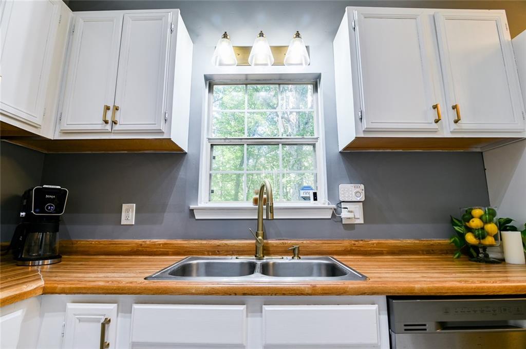 40 Mildred Lane Covington, GA 30016 - Photo 22 of 56 a kitchen with a sink and a window