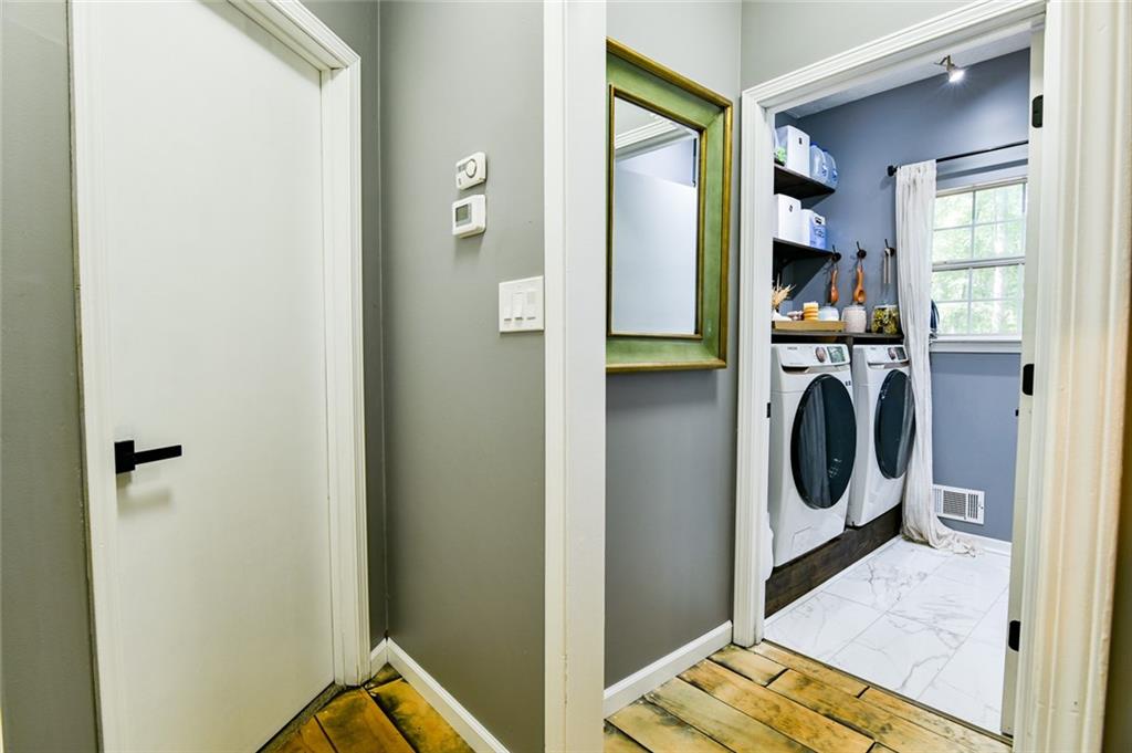 40 Mildred Lane Covington, GA 30016 - Photo 27 of 56 a view of a bedroom with washer and dryer