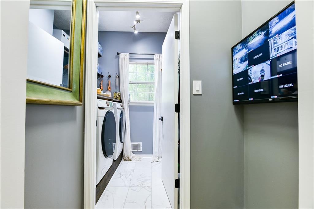 40 Mildred Lane Covington, GA 30016 - Photo 28 of 56 a view of a walk in closet and bedroom