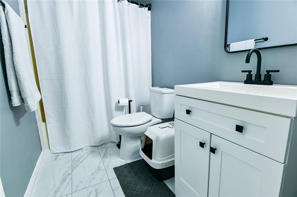 40 Mildred Lane Covington, GA 30016 - Photo 38 of 56 a bathroom with a sink and toilet