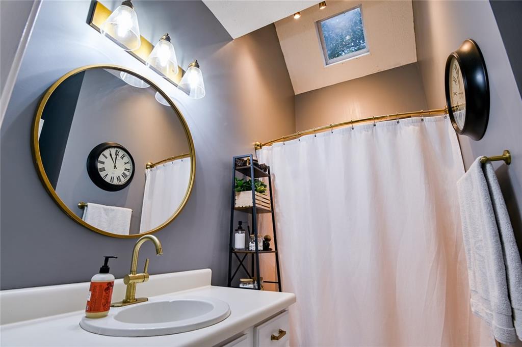 40 Mildred Lane Covington, GA 30016 - Photo 45 of 56 a bathroom with a sink and a mirror