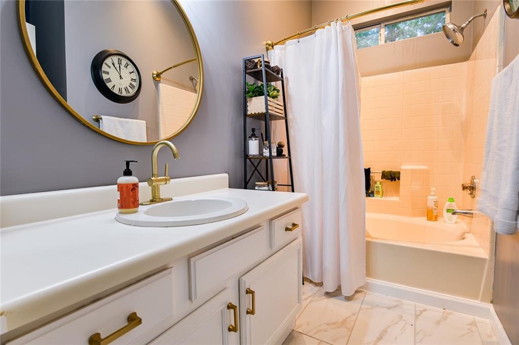 40 Mildred Lane Covington, GA 30016 - Photo 46 of 56 a bathroom with a sink and a mirror