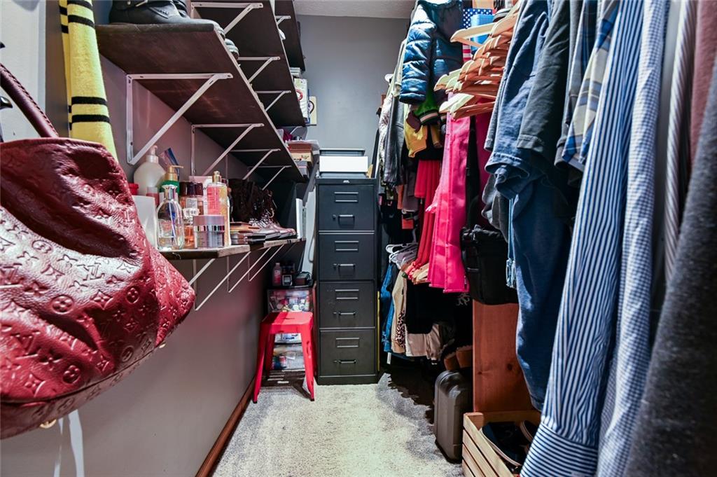40 Mildred Lane Covington, GA 30016 - Photo 47 of 56 a view of walk in closet with clothes