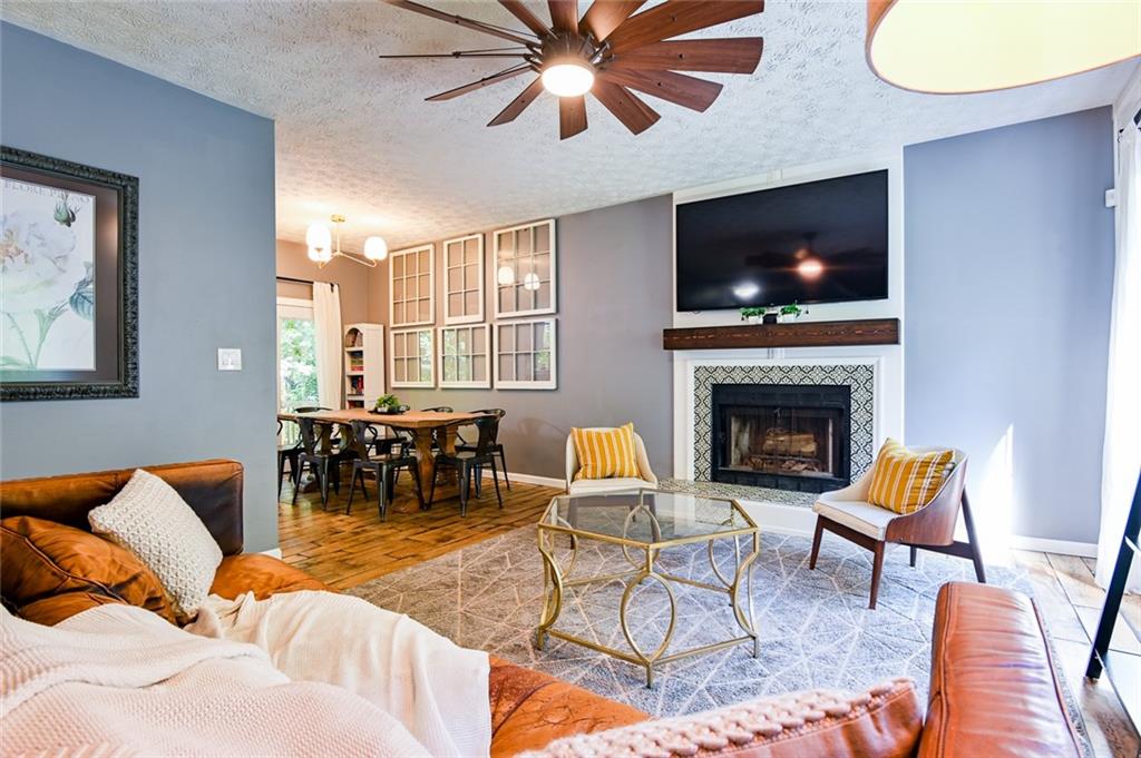 40 Mildred Lane Covington, GA 30016 - Photo 8 of 56 a living room with furniture a flat screen tv and a fireplace