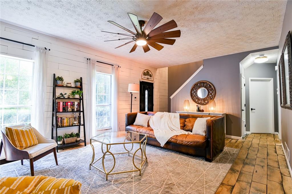 40 Mildred Lane Covington, GA 30016 - Photo 10 of 56 a living room with furniture and a wooden floor