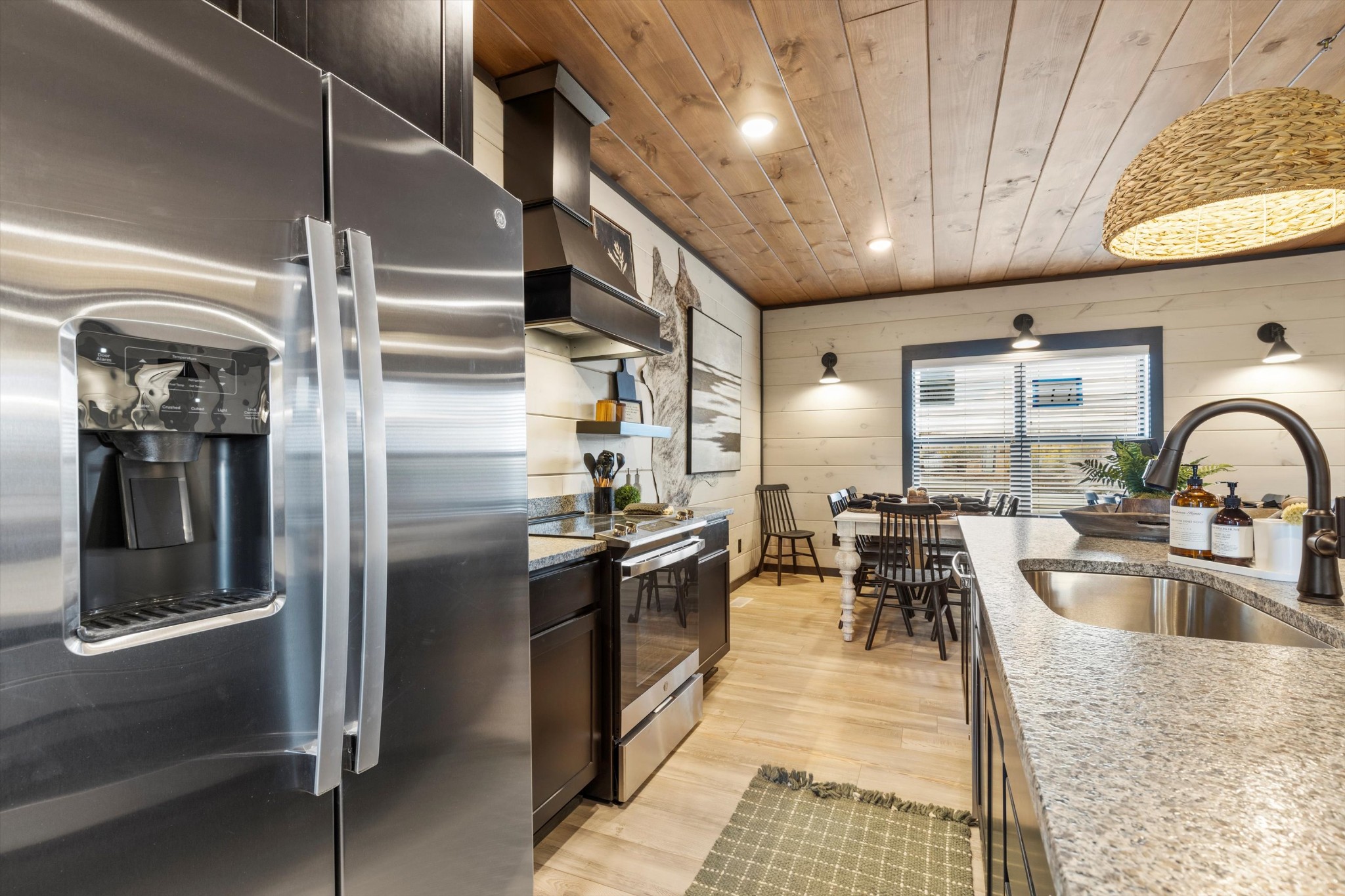 328 Rambling Creek Way Sevierville, TN 37862 - Photo 28 of 66 a kitchen with stainless steel appliances granite countertop a sink a stove and a refrigerator