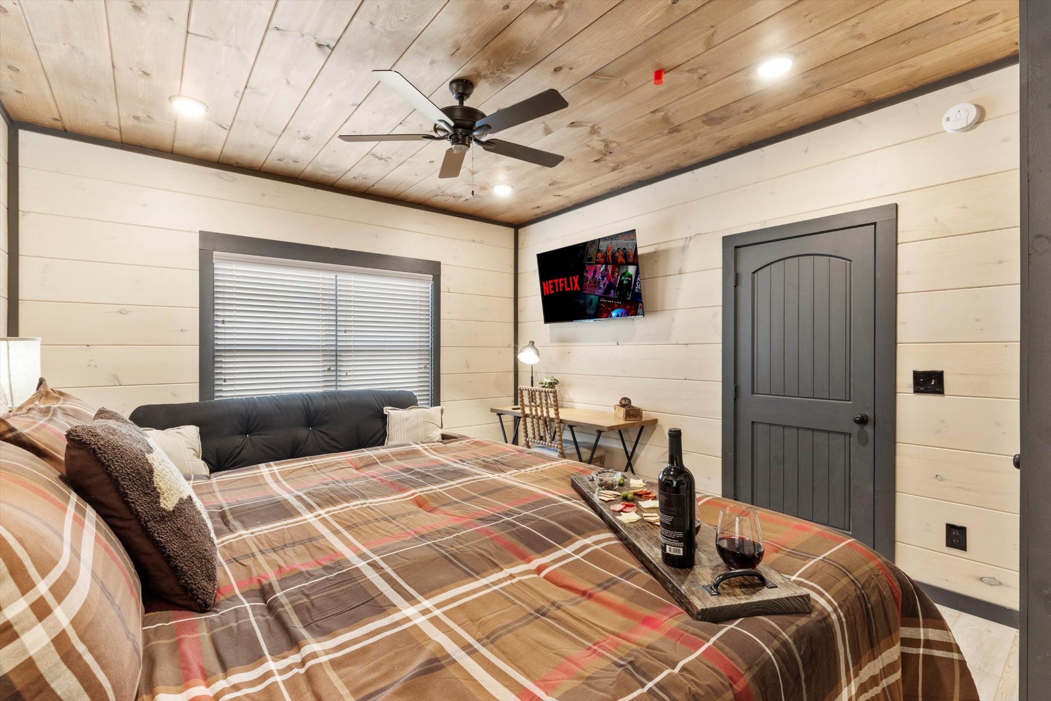 328 Rambling Creek Way Sevierville, TN 37862 - Photo 43 of 66 a bedroom with a bed and a chandelier