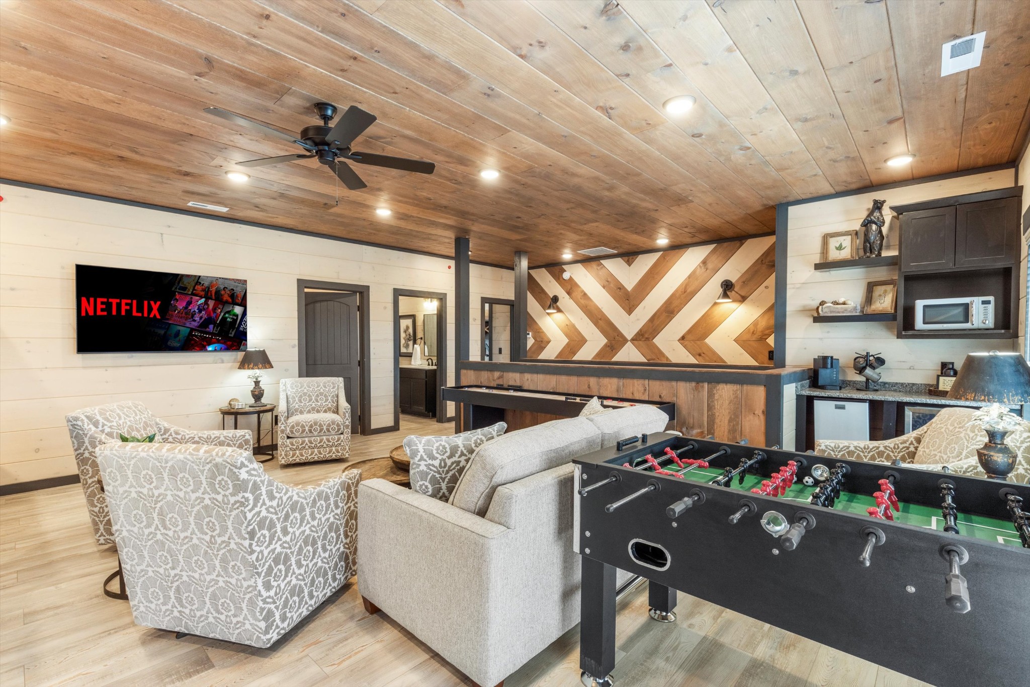 328 Rambling Creek Way Sevierville, TN 37862 - Photo 49 of 66 a living room with furniture and a flat screen tv