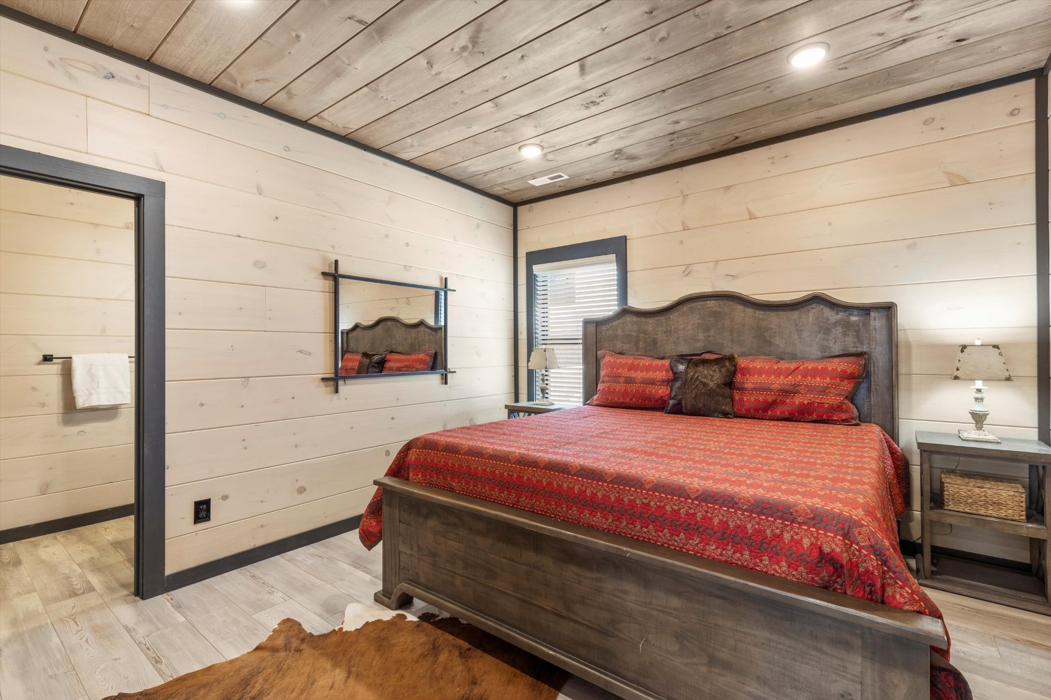 328 Rambling Creek Way Sevierville, TN 37862 - Photo 50 of 66 a bedroom with a bed and a painting on the wall