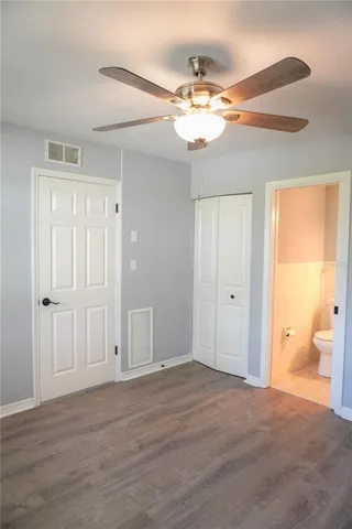 a view of a chandelier fan and entryway