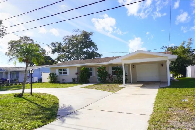 a view of a house with garden and porch