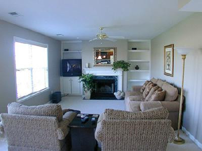 FAMILY ROOM WITH BOOKSHELVES, WOOD BURNI