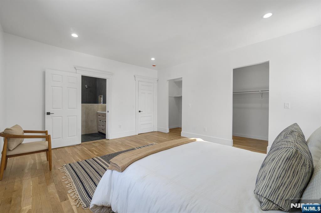 60 Stanley Road South Orange, NJ 07079 - Photo 13 of 40 a spacious bedroom with a bed and a chair
