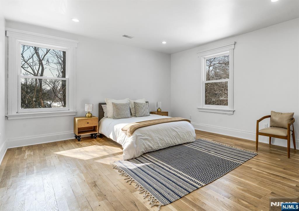 60 Stanley Road South Orange, NJ 07079 - Photo 14 of 40 a bedroom with a bed and wooden floor