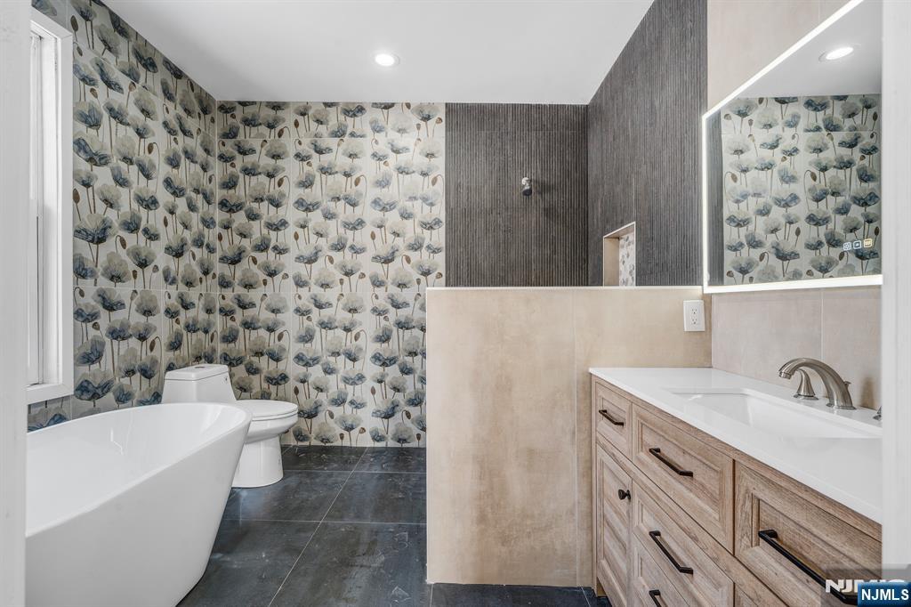 60 Stanley Road South Orange, NJ 07079 - Photo 15 of 40 a bathroom with a bathtub and a sink