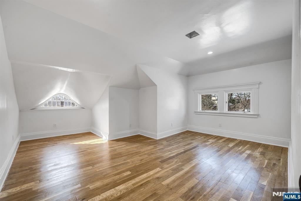 60 Stanley Road South Orange, NJ 07079 - Photo 19 of 40 an empty room with wooden floor and windows