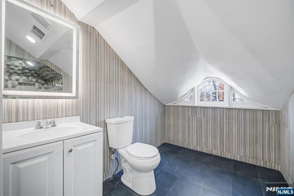 60 Stanley Road South Orange, NJ 07079 - Photo 20 of 40 a bathroom with a toilet a sink and a window