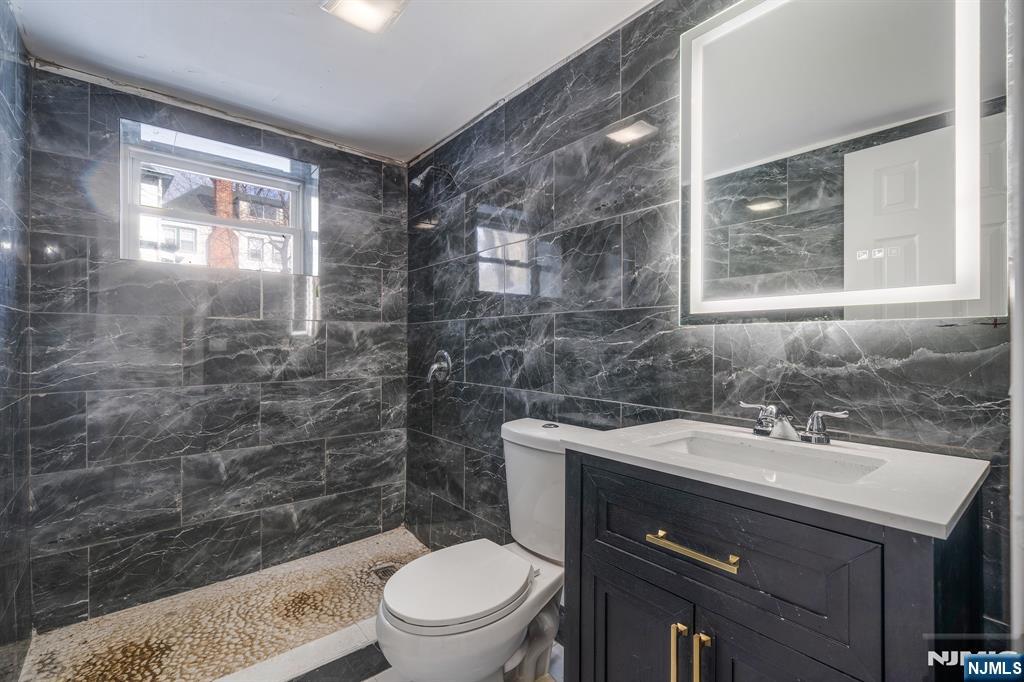 60 Stanley Road South Orange, NJ 07079 - Photo 24 of 40 a bathroom with a sink a toilet and shower