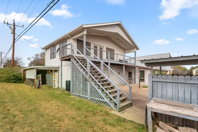 a front view of a house with deck