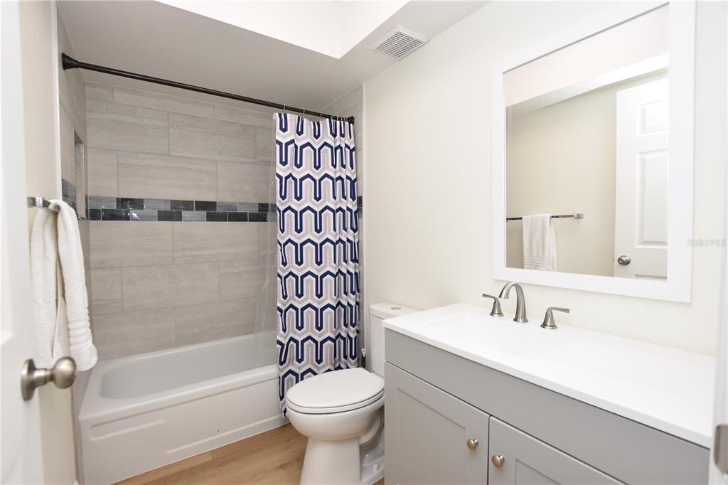 2025 Sylvester Road, Unit S2 Lakeland, FL 33803 - Photo 12 of 36 a bathroom with a sink a toilet and shower