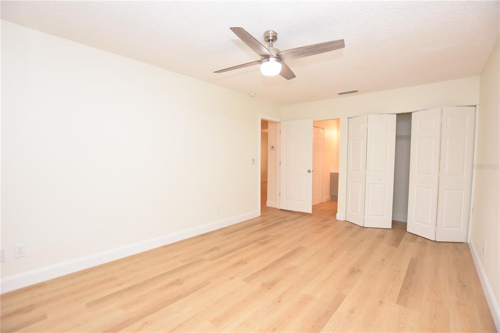 2025 Sylvester Road, Unit S2 Lakeland, FL 33803 - Photo 17 of 36 a view of a big room with wooden floor and windows