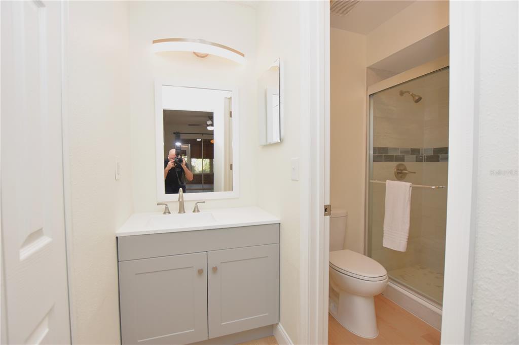 2025 Sylvester Road, Unit S2 Lakeland, FL 33803 - Photo 19 of 36 a bathroom with a toilet sink and mirror