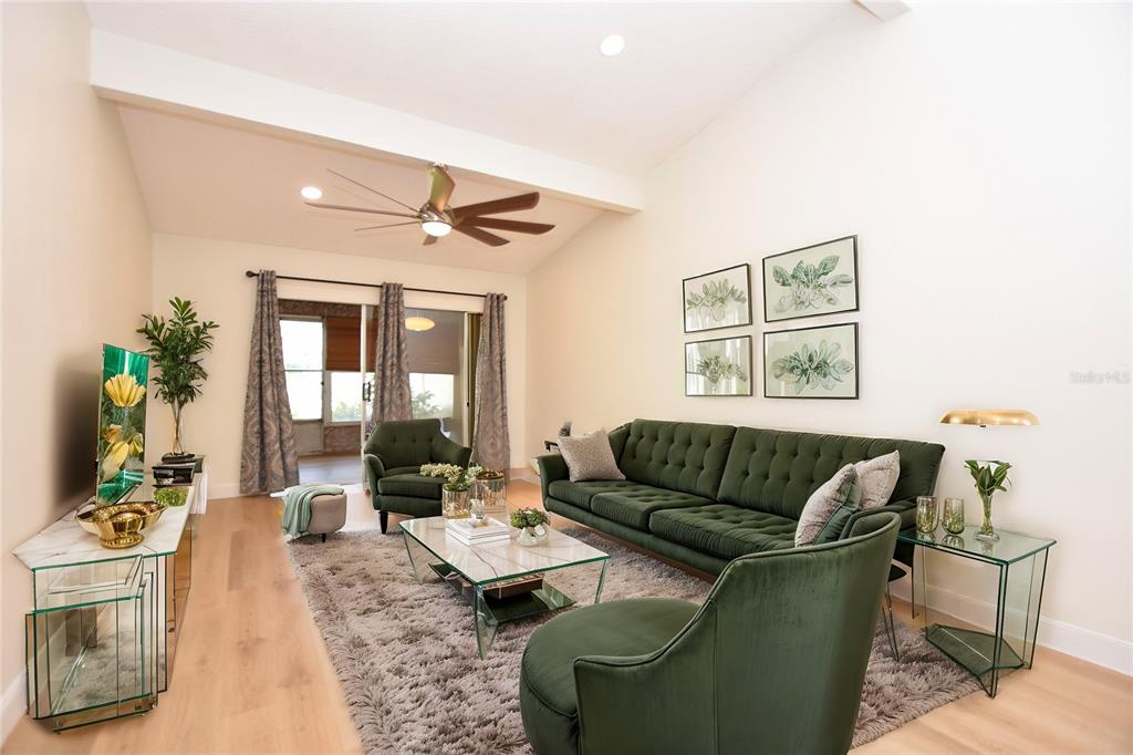2025 Sylvester Road, Unit S2 Lakeland, FL 33803 - Photo 20 of 36 a living room with furniture and wooden floor