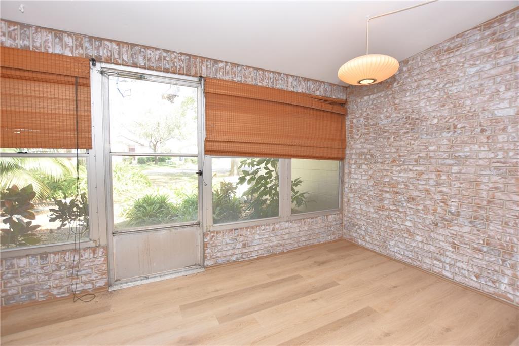 2025 Sylvester Road, Unit S2 Lakeland, FL 33803 - Photo 28 of 36 a view of empty room with wooden floor and fan