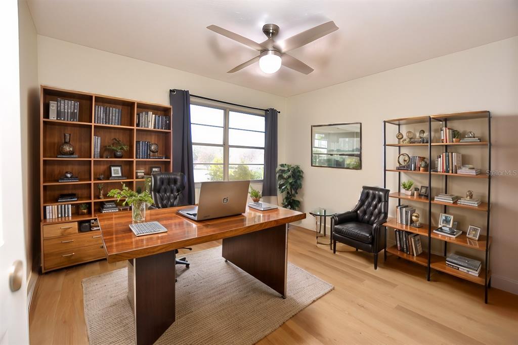2025 Sylvester Road, Unit S2 Lakeland, FL 33803 - Photo 10 of 36 a view of a workspace with furniture and a window