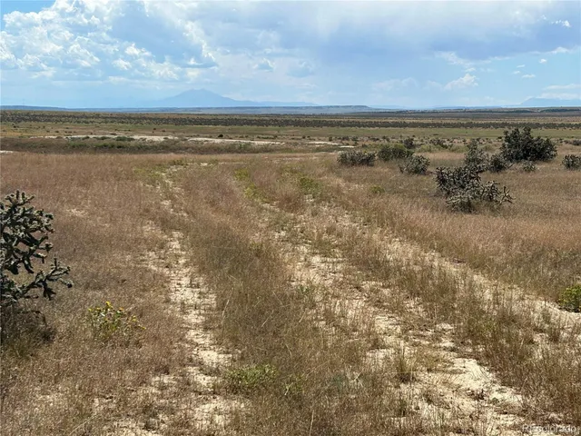a view of a lake with houses in the back