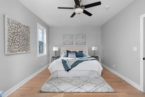 a large white bed in a white room