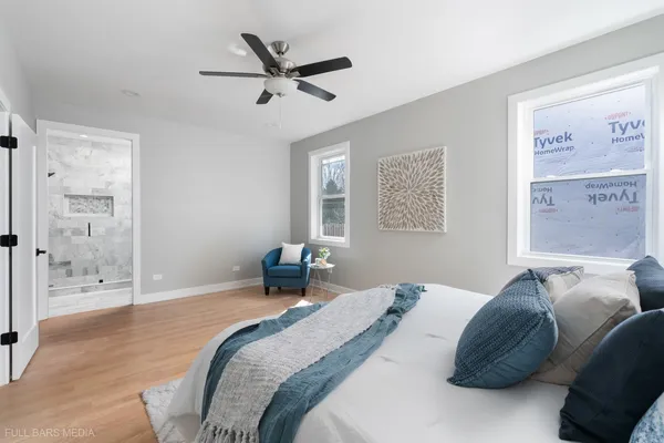 a bedroom with a bed and window