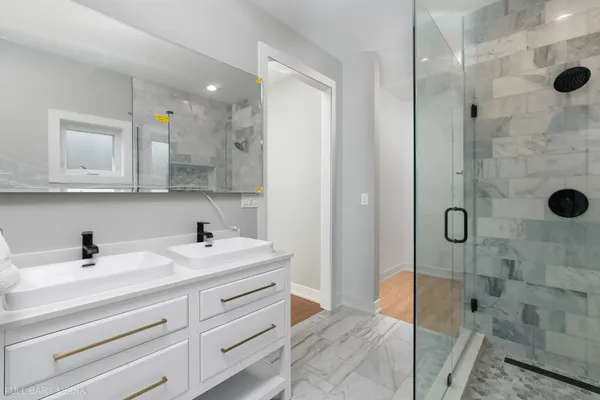 a bathroom with a sink and shower