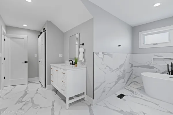 a bathroom with a bathtub sink and toilet