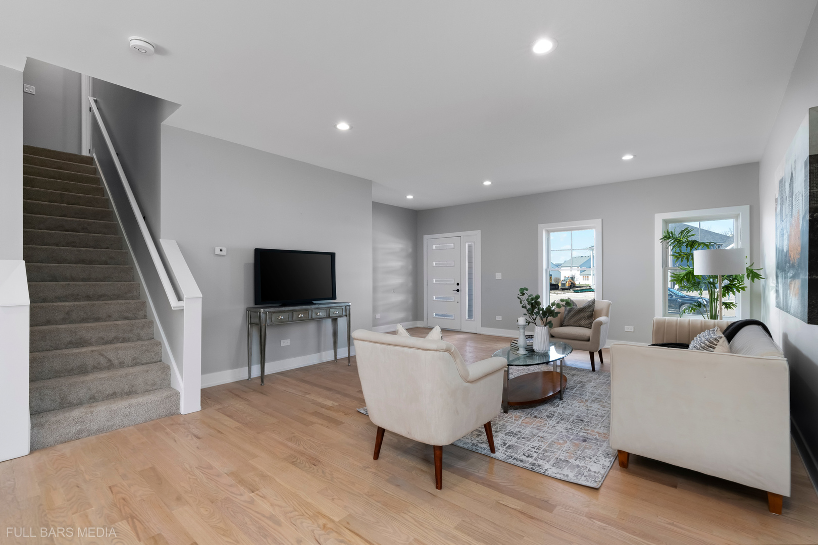 4019 Faith Lane St. Charles, IL 60174 - Photo 3 of 38 a living room with furniture and a flat screen tv
