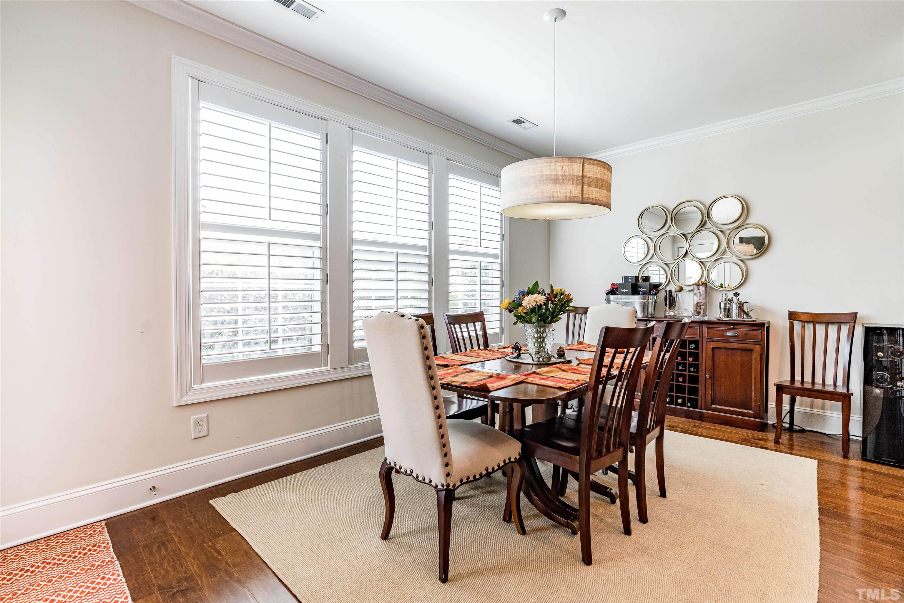 4020 Periwinkle Blue Lane Raleigh, NC 27612 - Photo 17 of 40 a view of a dining room with furniture and chandelier