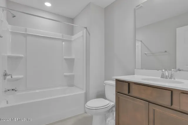 a bathroom with a sink toilet and bathtub