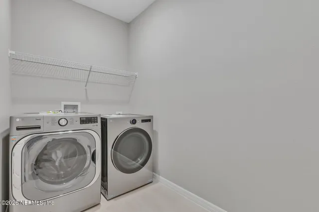 a utility room with dryer and washer