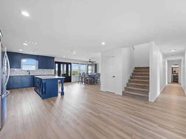 a bedroom with furniture and a wooden floor