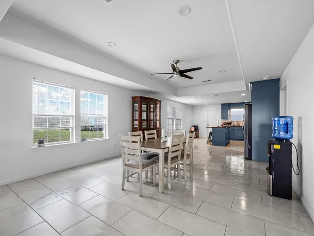 a view of a livingroom with furniture and a window