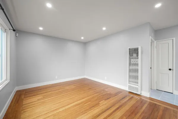 a view of an empty room and window