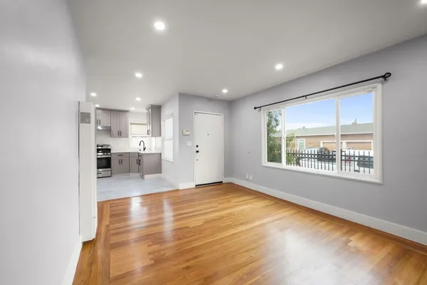 a kitchen with stainless steel appliances granite countertop a refrigerator sink and cabinets