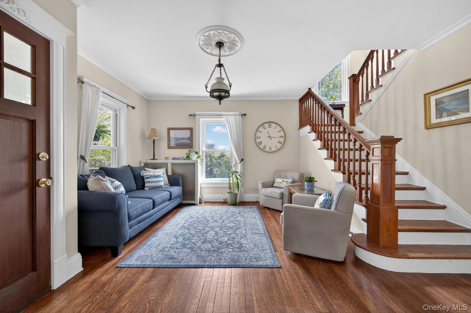 17 Riggs Place Locust Valley, NY 11560 - Photo 7 of 25 Living room with original staircase