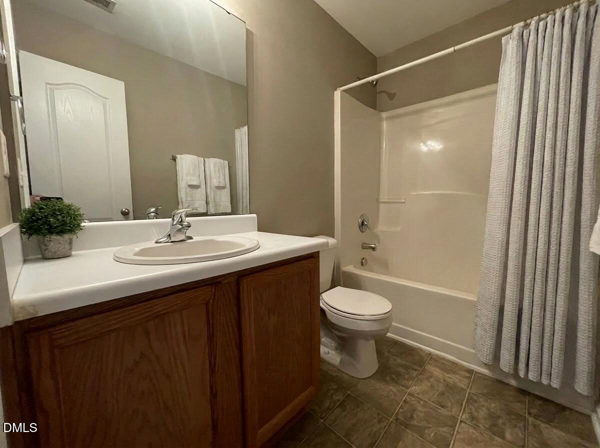 3531 Oneonta Avenue Raleigh, NC 27604 - Photo 19 of 22 a bathroom with a sink and a mirror