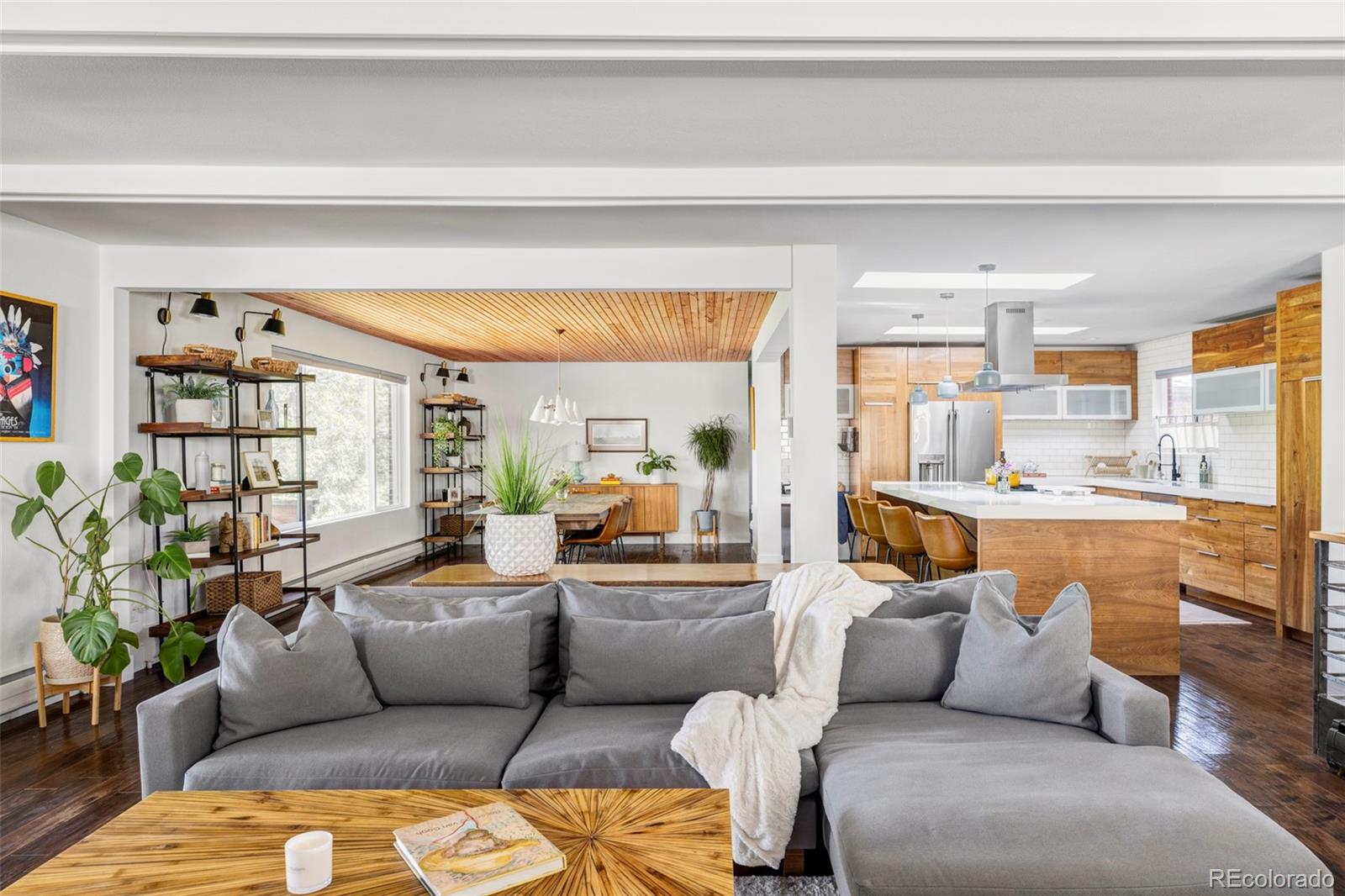 3370 Ward Road Wheat Ridge, CO 80033 - Photo 14 of 42 a living room with furniture and a large window